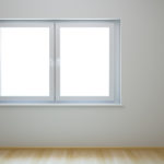 A white window in an empty room with no one inside.