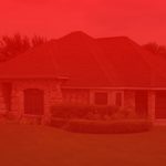 A red image of a house with a sky background