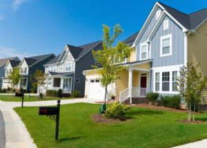 Suburban neighborhood with modern, colorful houses.
