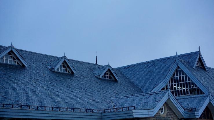 Victorian-style roof with gabled windows.