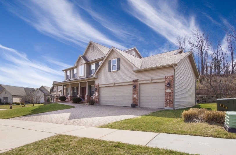 Suburban house with garage and driveway.