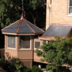 Octagonal sunroom attached to a house.