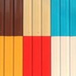 Colorful corrugated metal panels in geometric pattern.