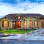 Modern suburban house with landscaped front yard.