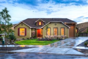 Modern suburban house with landscaped front yard.