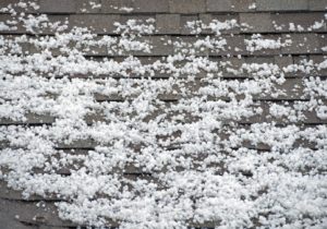 Hailstones scattered on a roof surface.