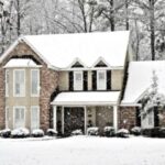 House covered in snow during wintertime.