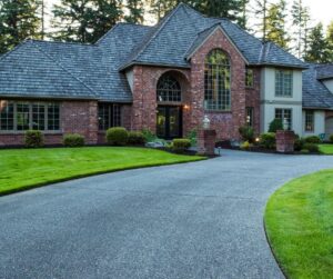 Large brick house with curved driveway.