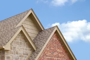 Gable roofs with brick and stone walls.