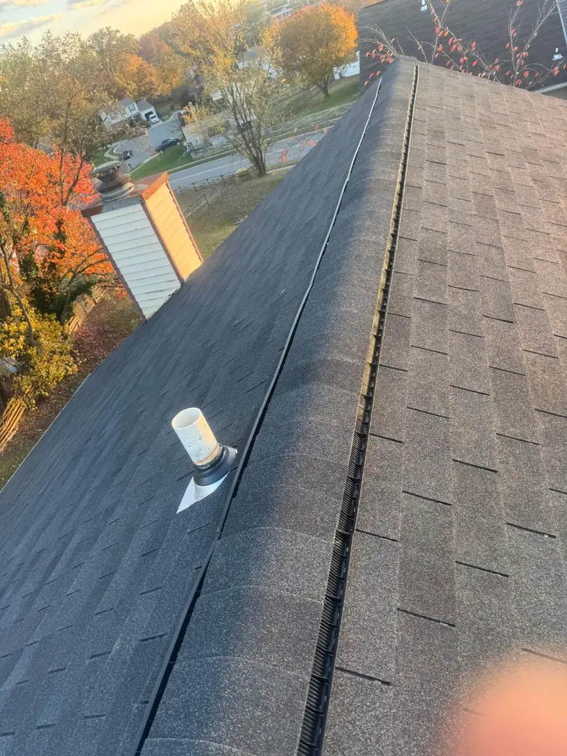 Finished GAF Timberline shingle roof with ridge ventilation on a Maryland home