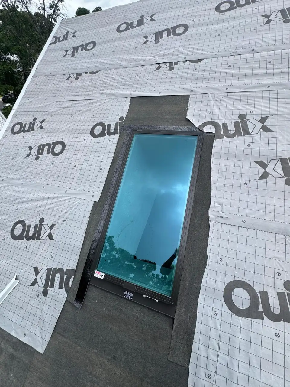New skylight installation during a shingle roofing project in Maryland