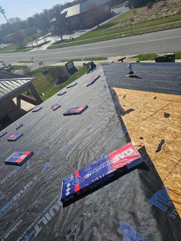 Roof underlayment installation during the Agape Physical Therapy roof replacement in Forest Hill, MD
