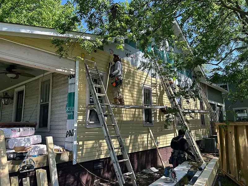 Real Ray’s siding installation work in progress; location not confirmed.